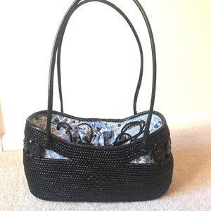 Black woven straw purse from Anthropologie